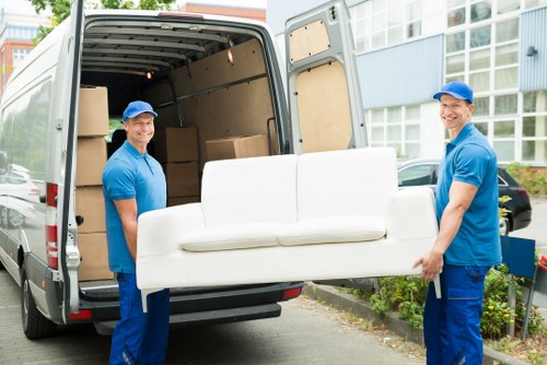 Man with a van loading household furniture in Lisson Grove