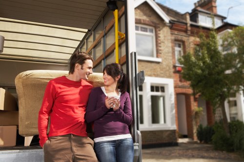 Packing and loading household items into a moving van in Lisson Grove