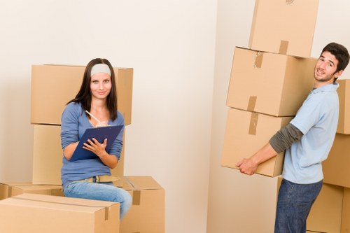 Local moving team handling boxes and furniture in central London